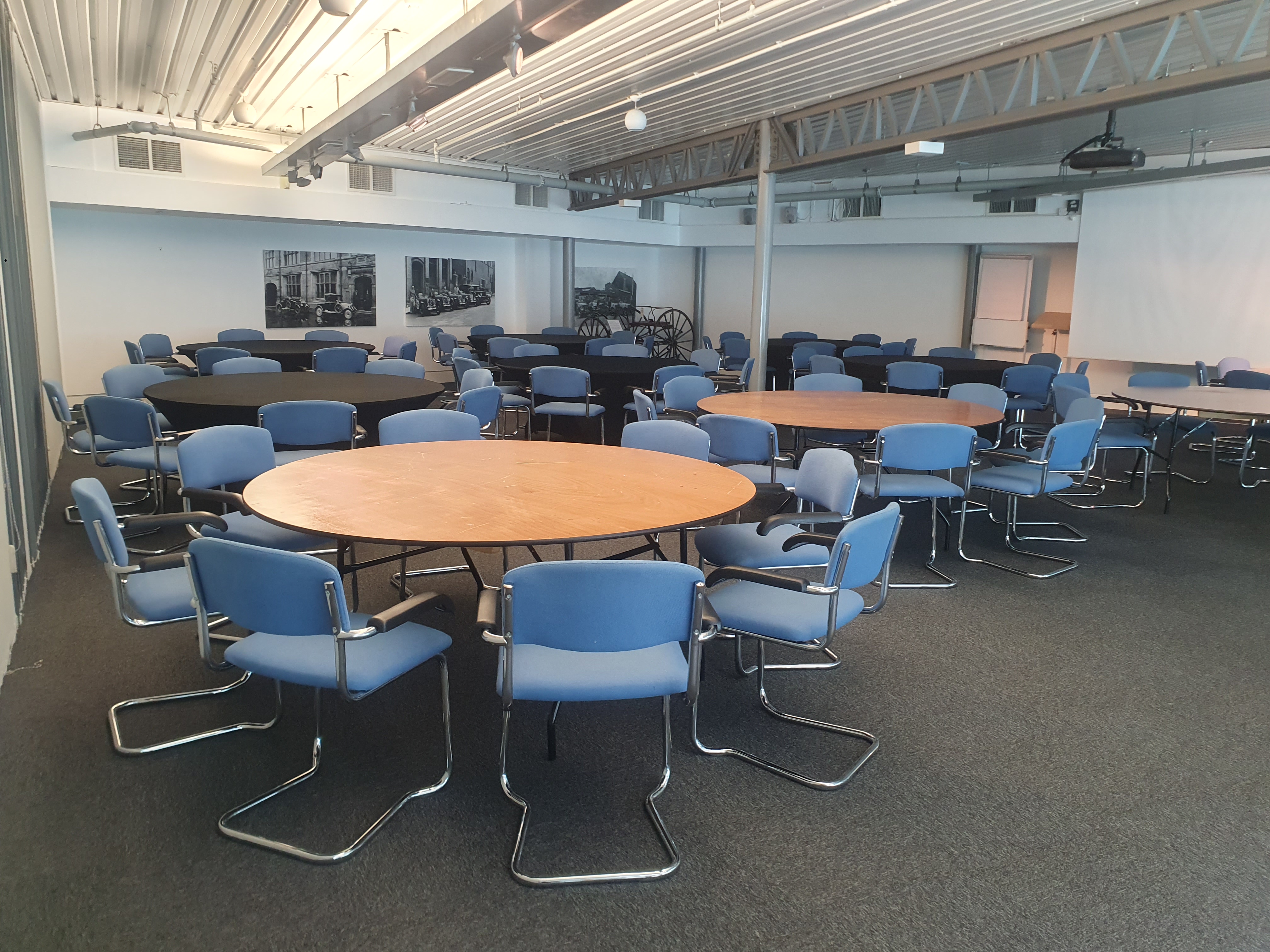 Photo of the Starley Suite, a room with 6 tables surrounded by chairs